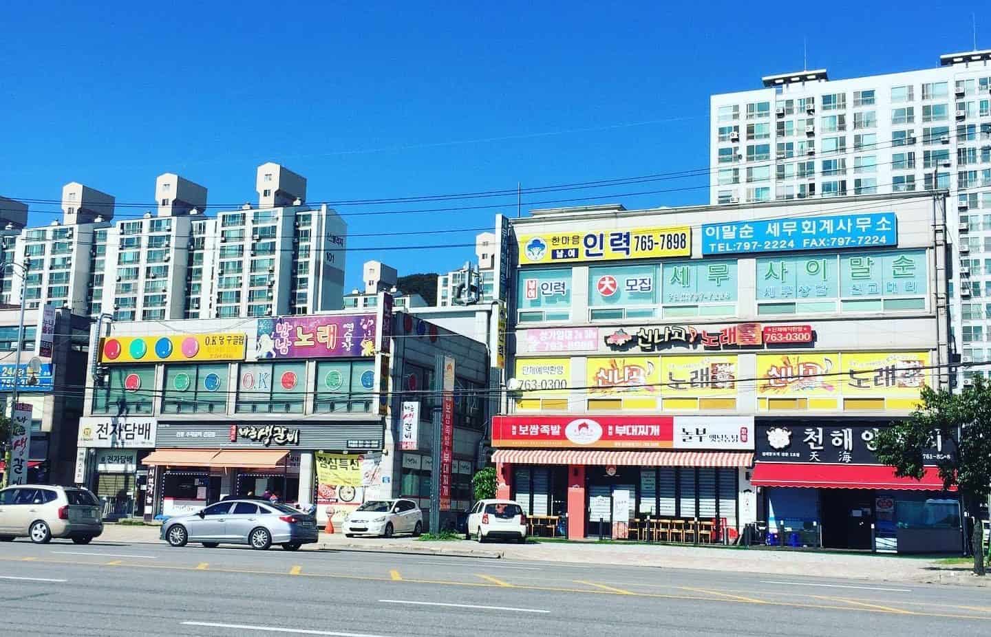 View of colorful Korean businesses fronts.