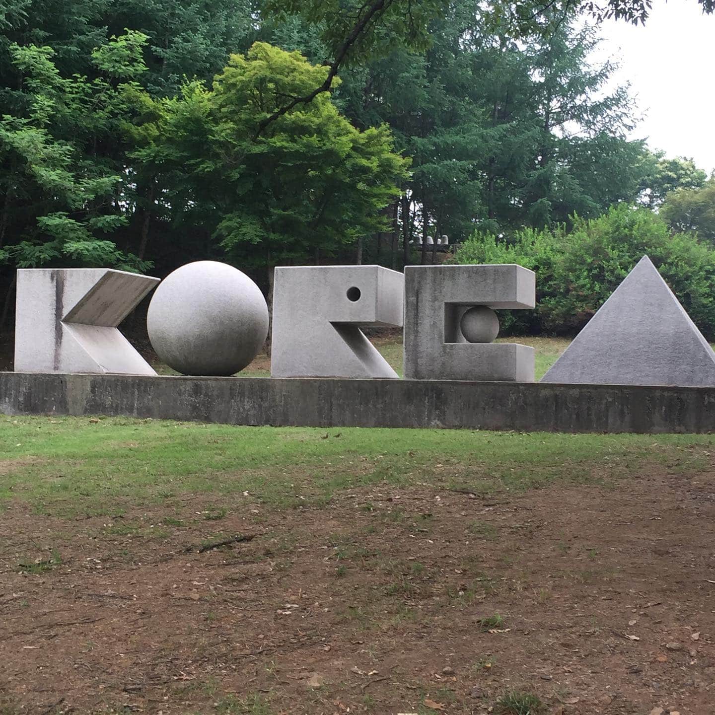 A granite sign carved into letters spelling Korea in Gonjiam
