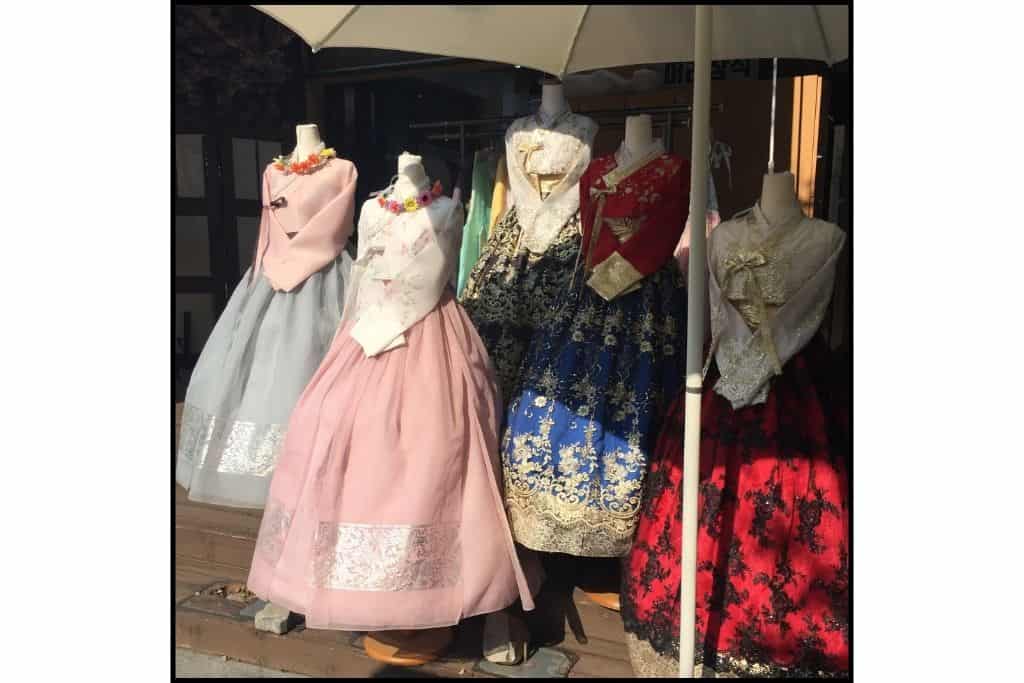 Several tradsitional dresses called hanbok on display for rental.