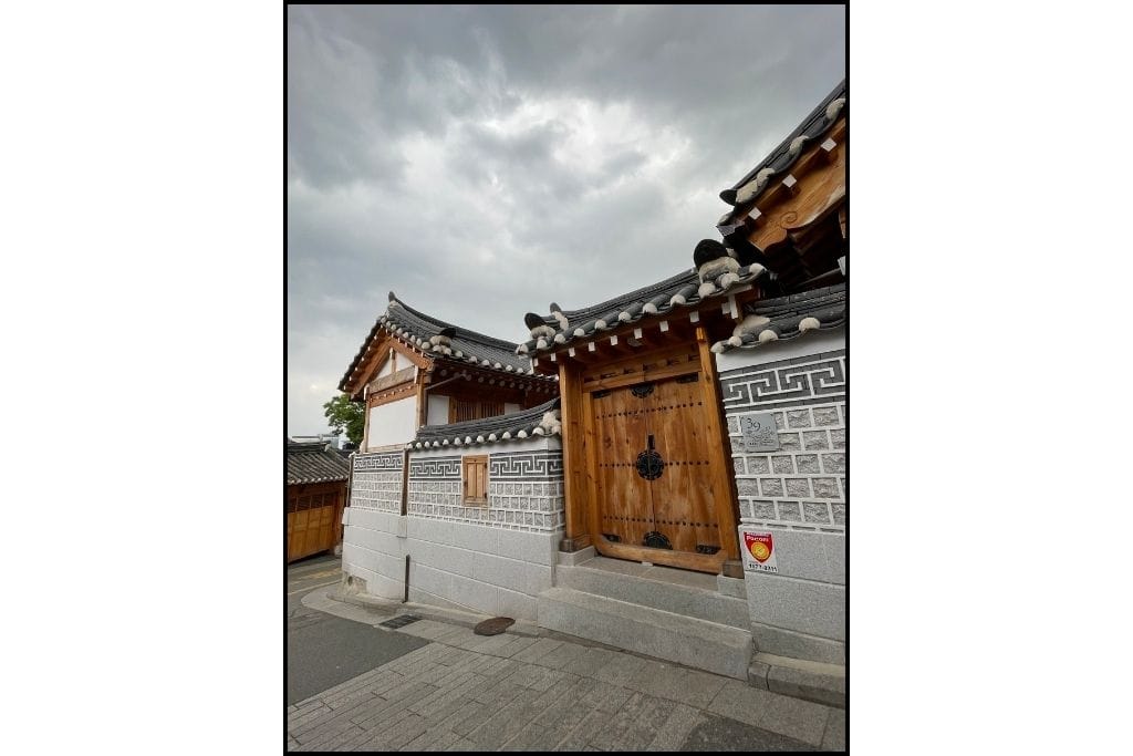 A hanok, a traditional Korean home and it's wood door at Bukchon Hanok Village