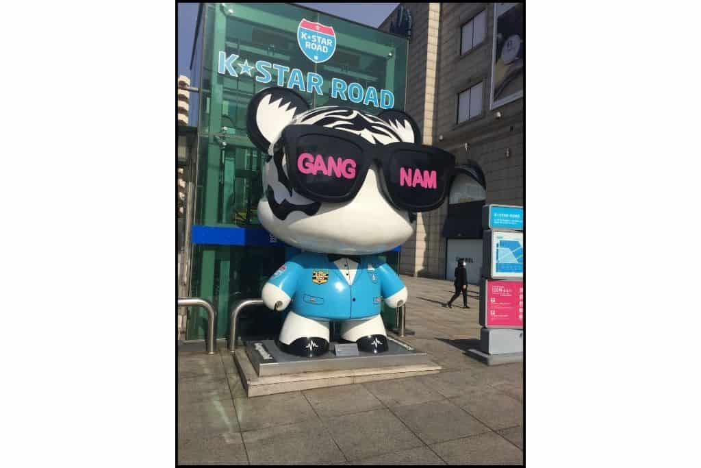 K-Star road 'Gangnam Style' gangnamdol wearing sunglasses and a blue jacket
