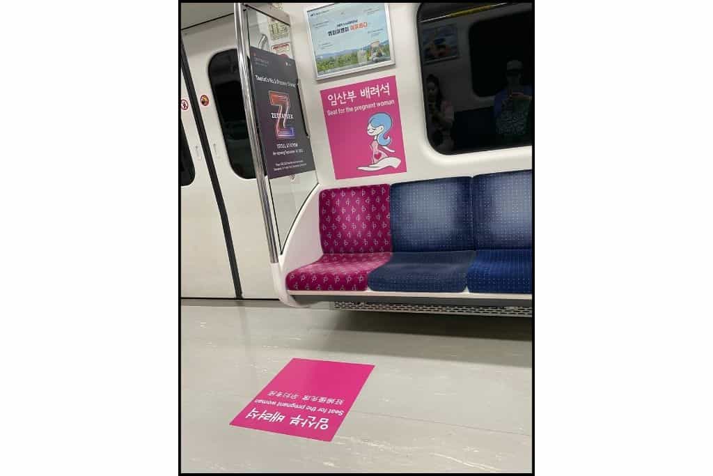 The pink priority seat reserved for pregnant women on a subway in South Korea.