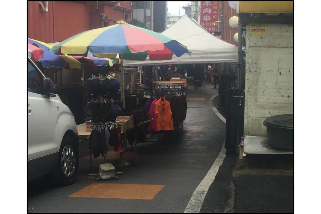 A vendor selling products at a market in South Korea