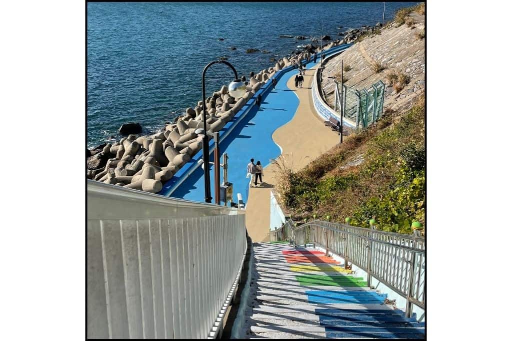 The famous piano stairs leading down toJeoryeong Coastal Walk at Huinnyeoul Village in Busan