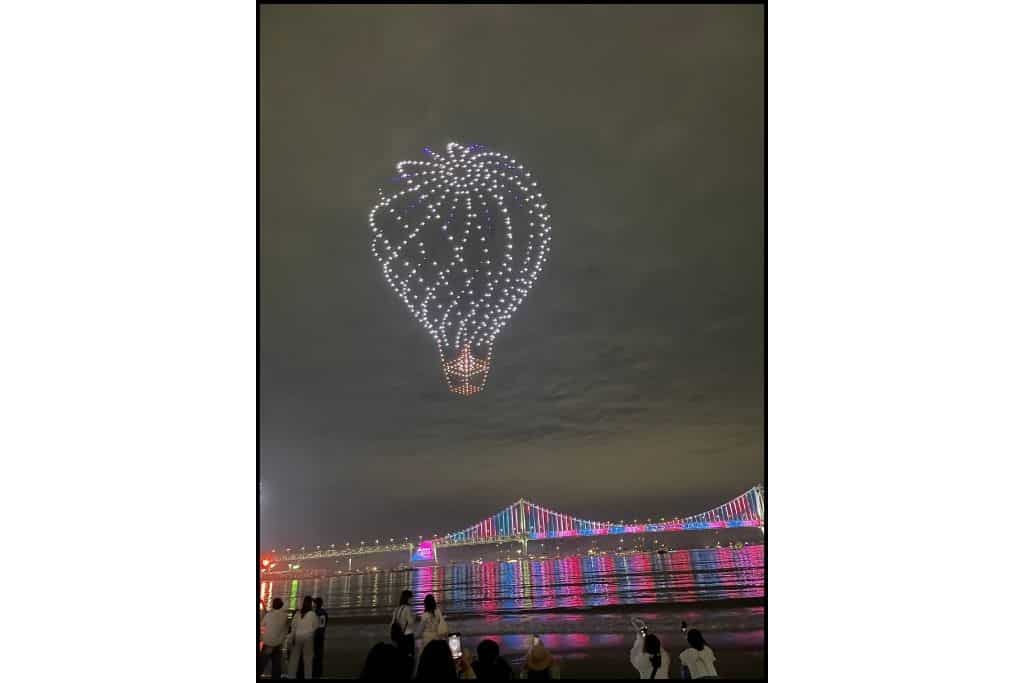 The drone show of a hot air ballon in front of the bridge at Gwangali beach is a free thing to do in Busan
