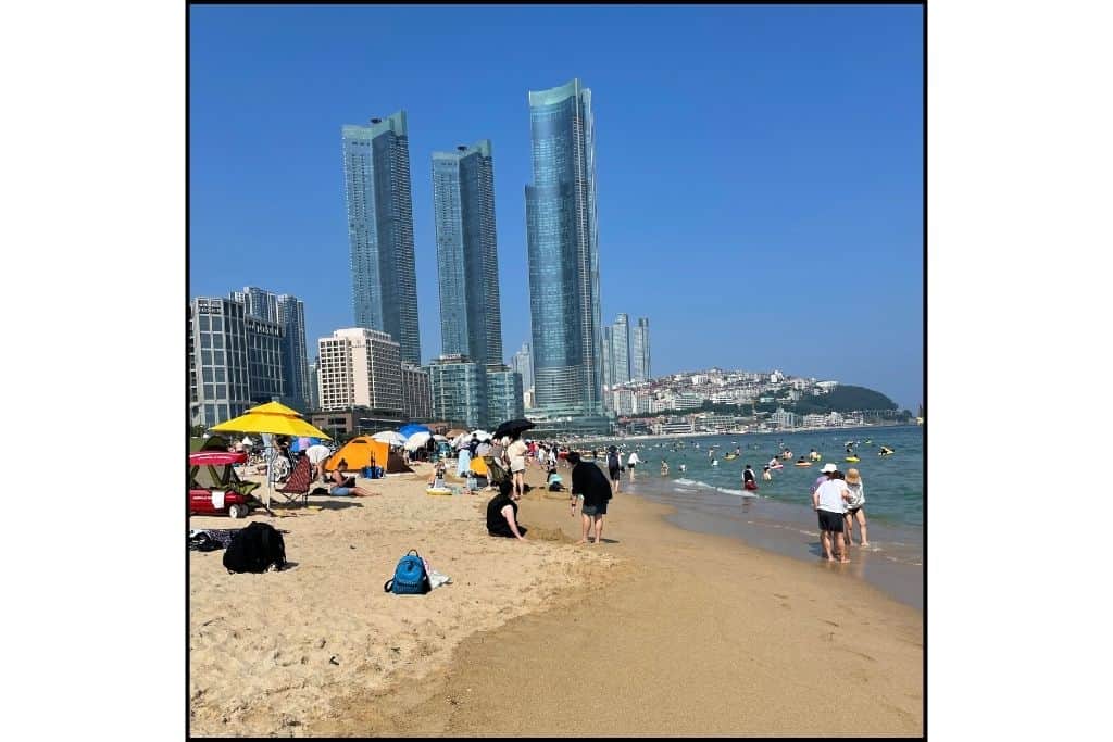 Haeundae Beach with its golden sands and vibrant atmosphere at the beginning of summer season—a must-visit thing to do in Busan.