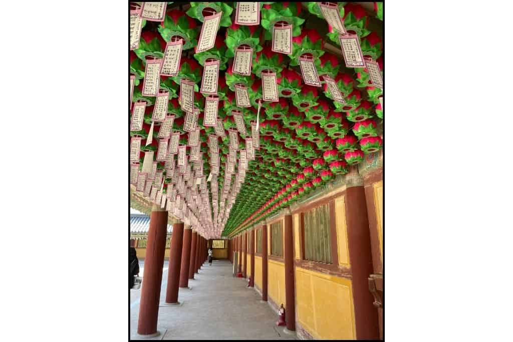 Dozens of colorful lanterns hanging at Bulguksa Temple in Gyeongju, creating a vibrant and festive atmosphere, perfect for a cultural day trip.