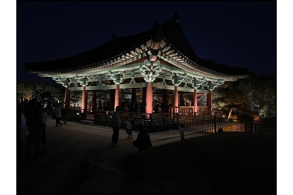 Donggung Palace pavilion lit up at night, beautifully illuminated against the dark sky, creating a stunning sight ideal for a day trip in Gyeongju.