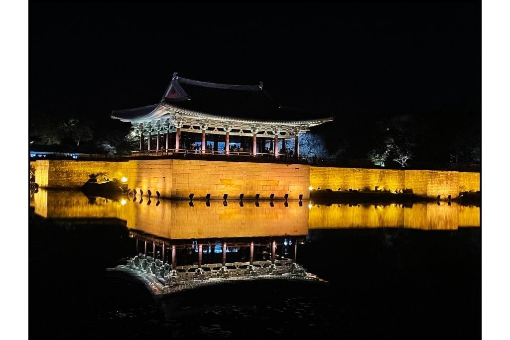 Donggung Palace pavilion lit up at night, beautifully illuminated against the dark sky, creating a stunning sight ideal for a day trip in Gyeongju.