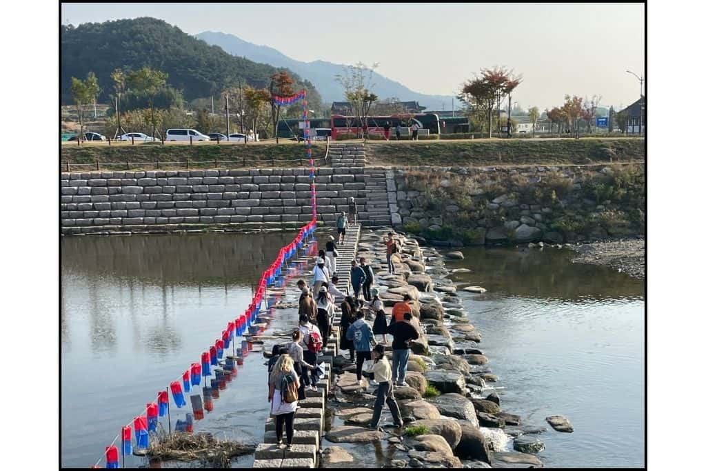 People crossingthe the river nearWoljeonggyo Bridge on a day trip in Gyeongju