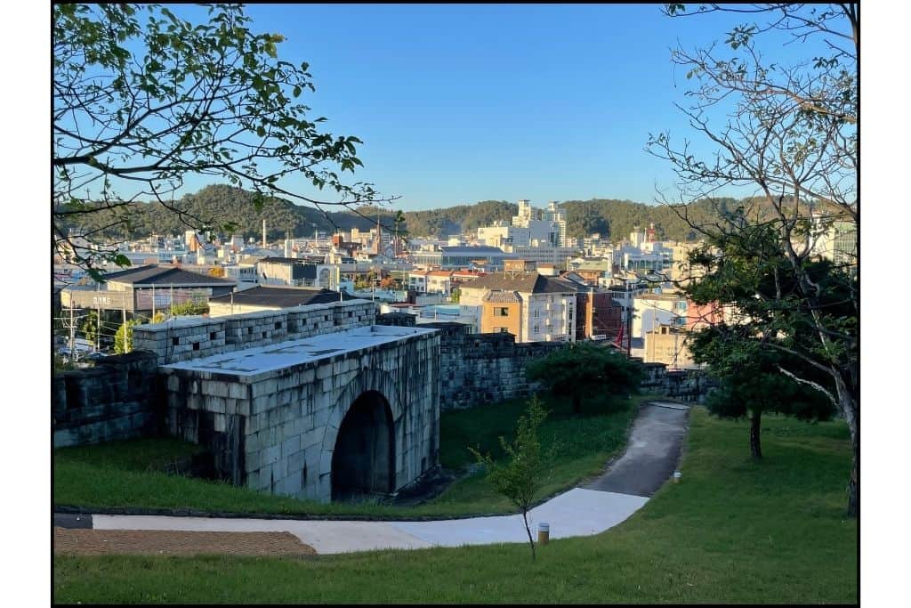 Jinjuseong Fortress walls and the city view on an autumn day in Jinju