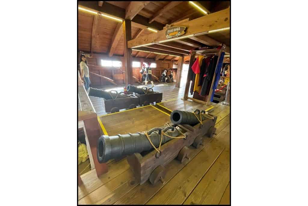 The interior of a turtle boat, including a canon and other artillery in Yeosu