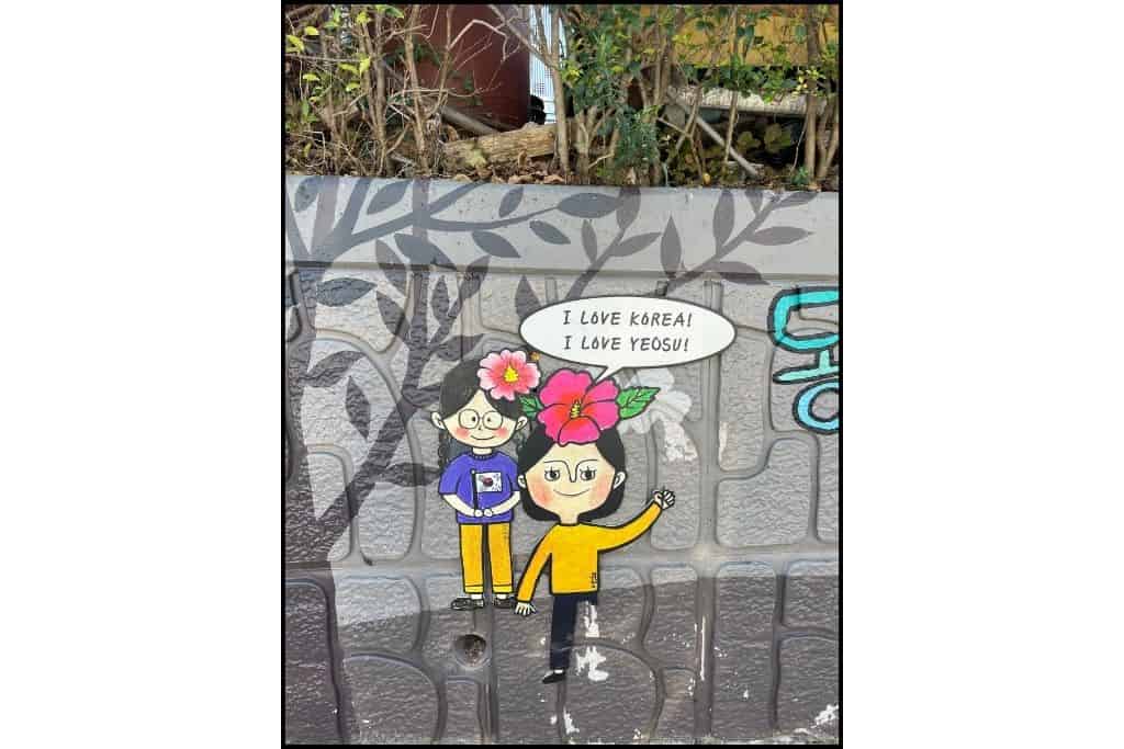 A mural of 2 girls saying I love Korea and I love Yeosu