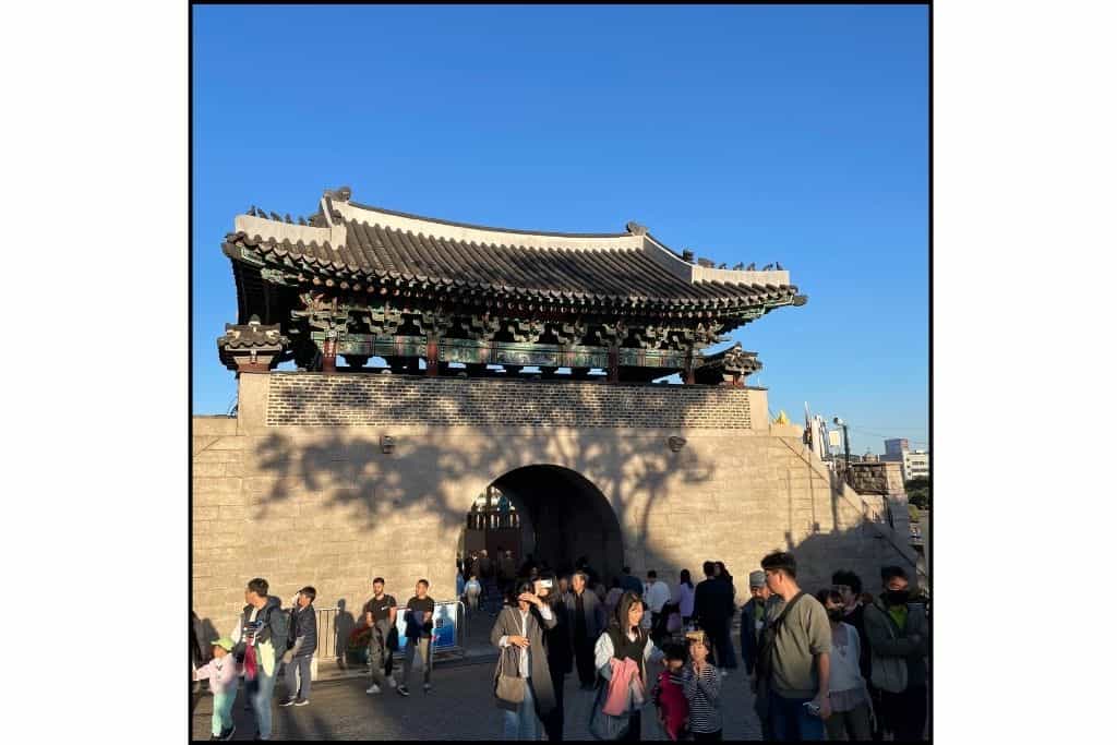 People are exploring Jinjuseong Fortress during the daytime at the Lantern festival, a fun thing to do in Jinju