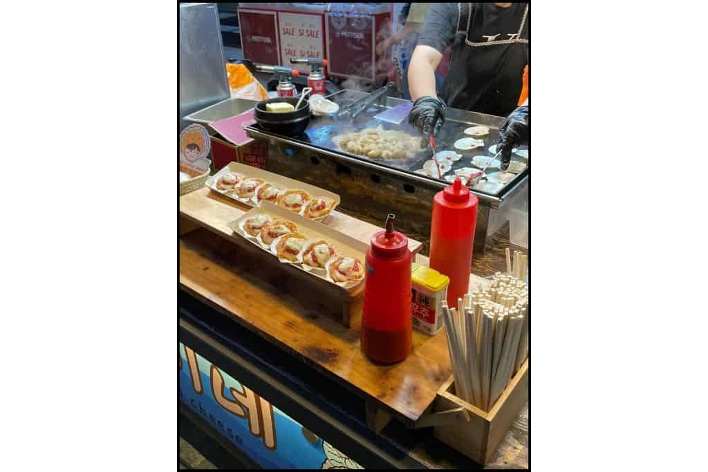 A food cart selling a Scallop dish in Myeongdong