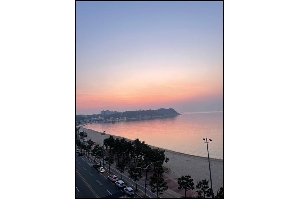 A beautiful sunrise from a hotel room on the beach at Yeongildae beach Pohang