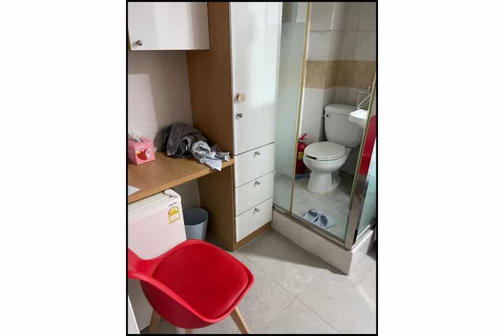 A snapshot of the desk, storage and private toilet at a goshiwon in South Korea