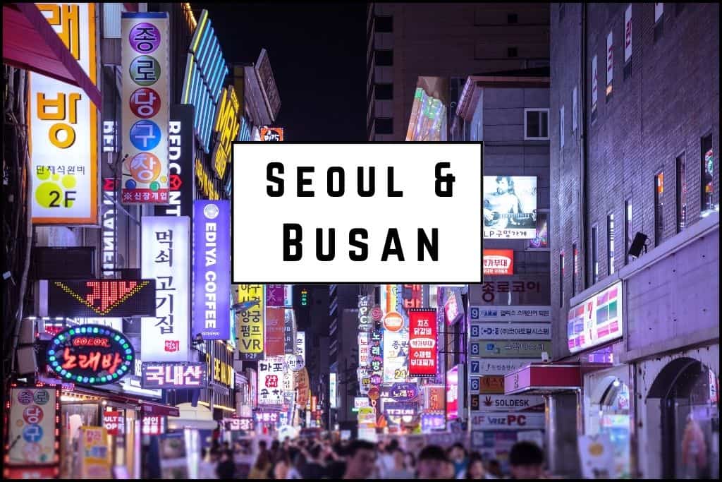 Vibrant city street at night illuminated by bright neon signs and storefront lights, creating a lively and bustling atmosphere in South Korea