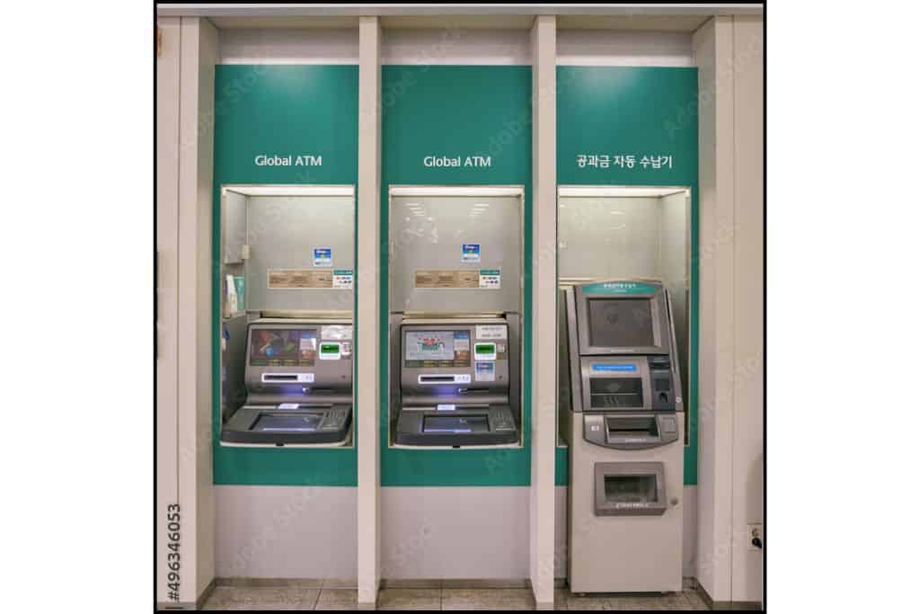 Three ATMs in South Korea lined up side by side; two display 'Global ATM' signs, offering international card support.
