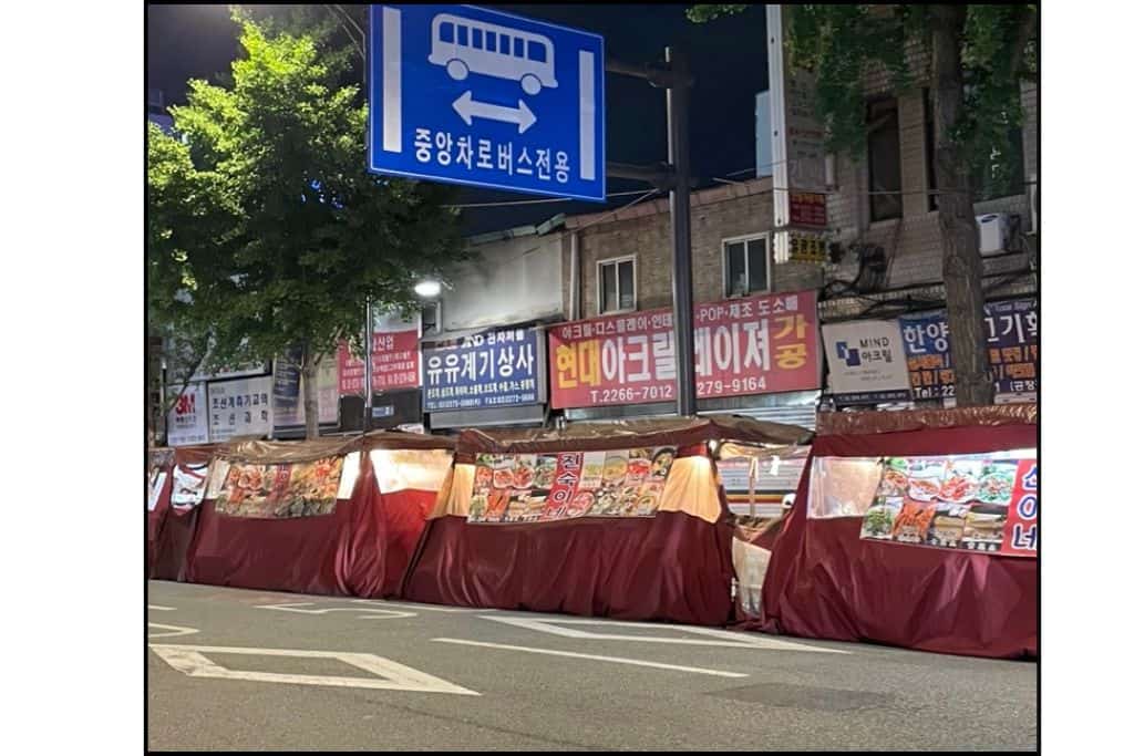 The iconic orange food stall tents in Sout Korea, known as pojangmacha tents