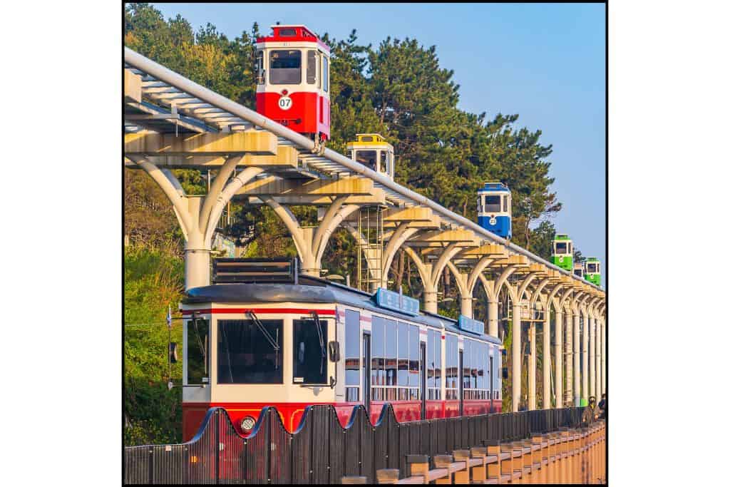 A photo of the Sky Capsule on the tracks above the Haeundae Beach train in Busan