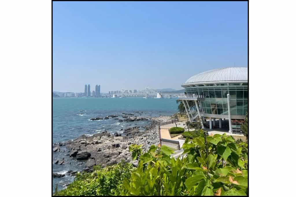 Coastal view of the ocean and Gwangan Bridge from Dongbaekseom Island in Busan.