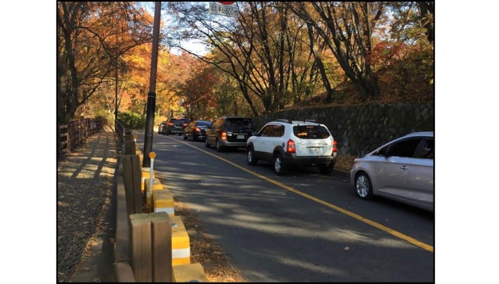Heavy weekend traffic on the road to Namhansanseong during autumn foliage season in Korea.