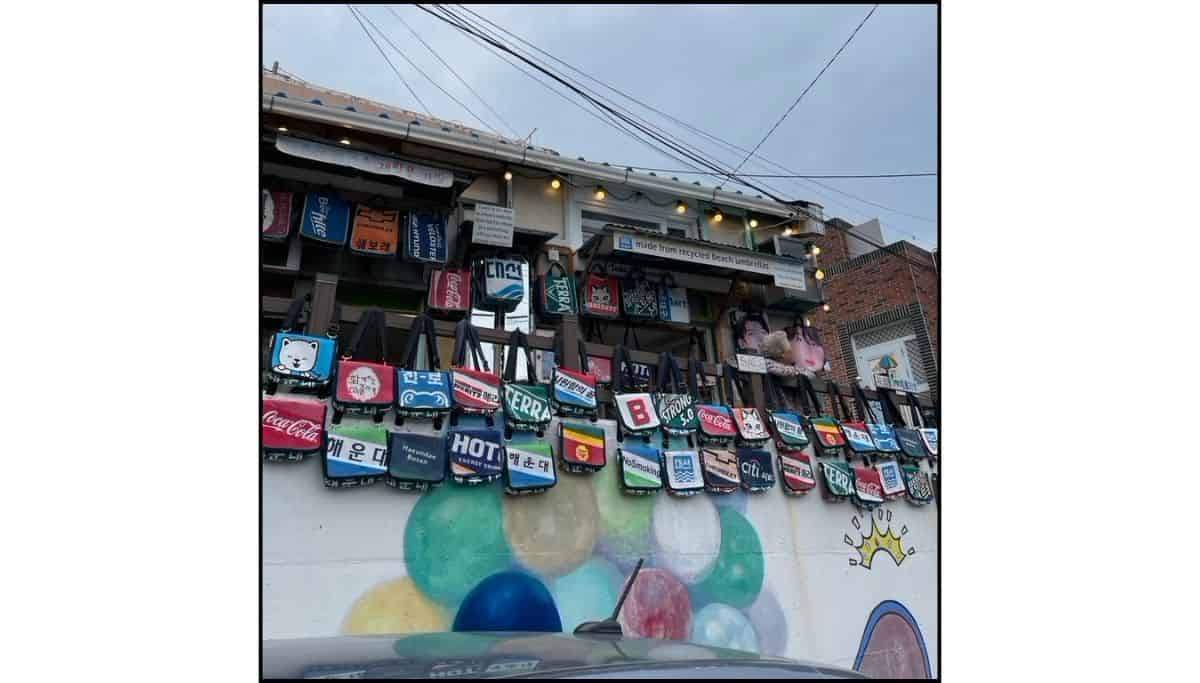 the wall of a shop in Gamcheon Cultural Village selling unique bags made from old beach unbrellas