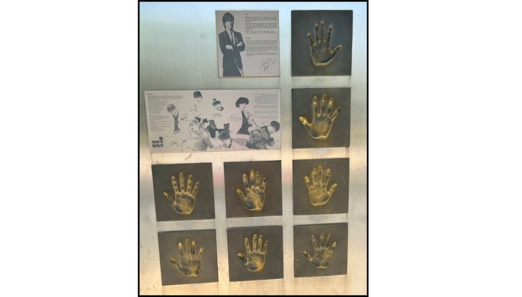 Bronze handprints, artist photos, and signatures displayed at Music Star Zone near Jamsil Olympic Stadium.