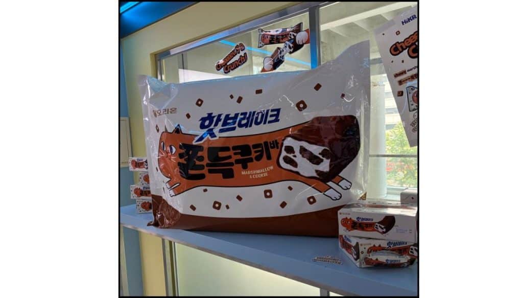 Oversized candy bar prop with Korean lettering sitting on a windowsill inside HiKR Ground.
