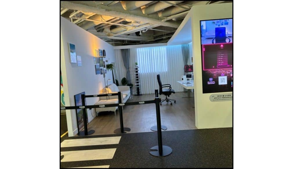 Streamer-style filming set with a couch, desk, curtains, camera light, and computer setup inside HiKR Ground.