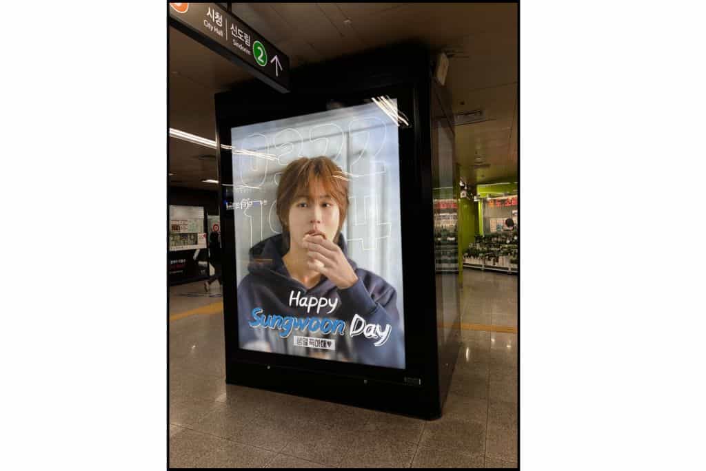 “Happy Sungwoon Day” digital birthday billboard featuring K-pop singer Ha Sungwoon inside a Seoul subway station.