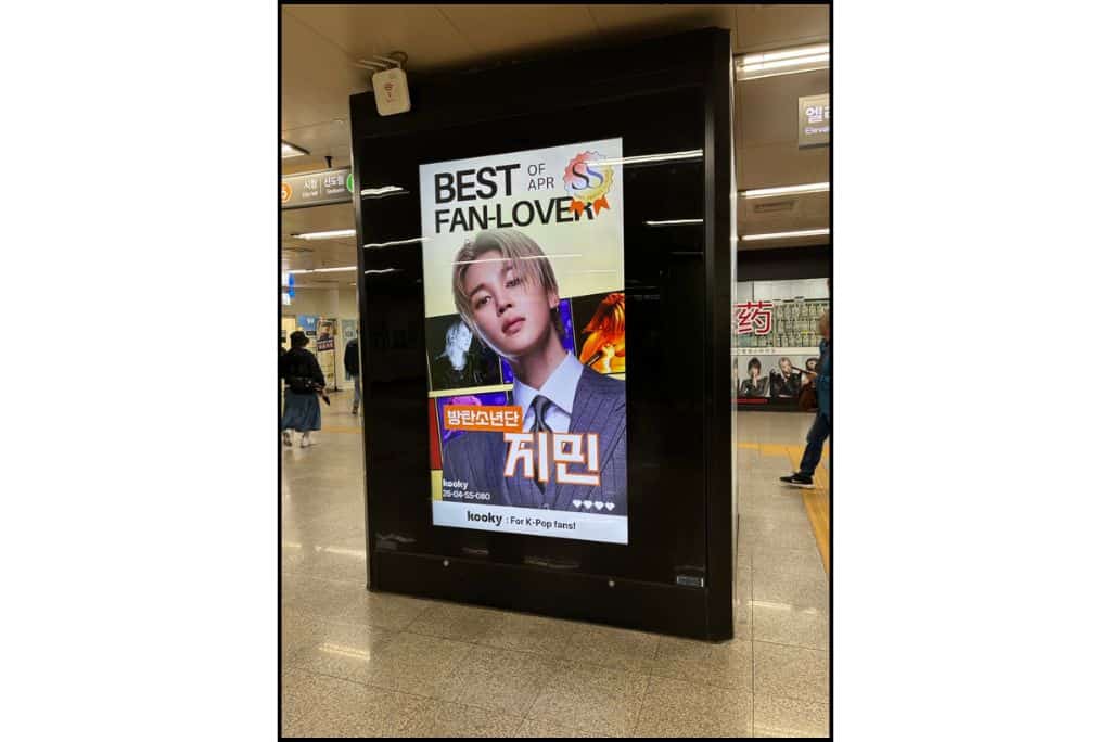 Digital subway advertisement featuring BTS member Jimin as the “Best of April Fan-Lover,” displayed inside a Seoul subway station.
